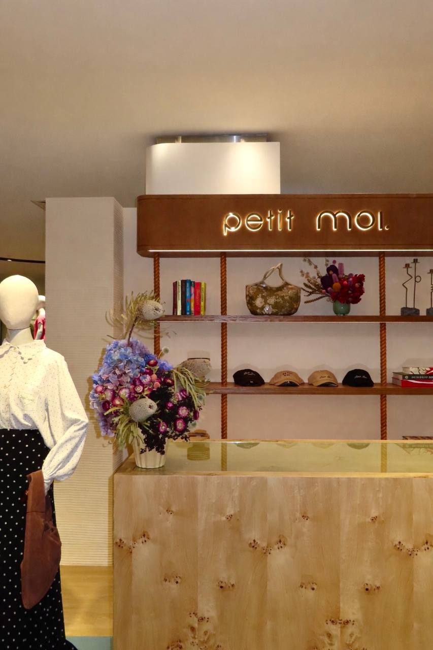 Petit Moi Isetan KLCC display counter, floral arrangement and illuminated timber shelving